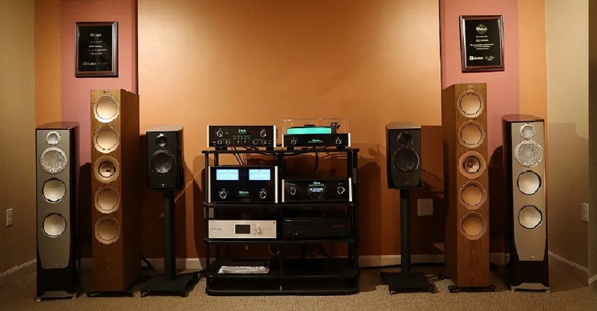 Showroom listening room with floor-standing speakers and a McIntosh electronics rack